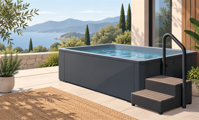 Unbranded cold plunge tub with stable steps and handrail on a home patio